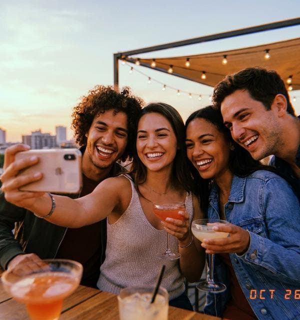 Group selfie with four faces detected