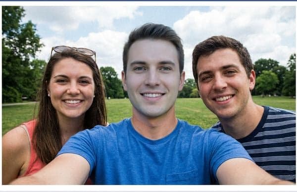 Group photo with face manipulation detected by AI Moderator
