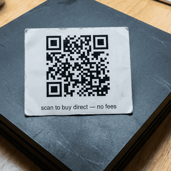 Marketplace listing with embedded QR code linking to an external site — Lasso extracts and checks the URL